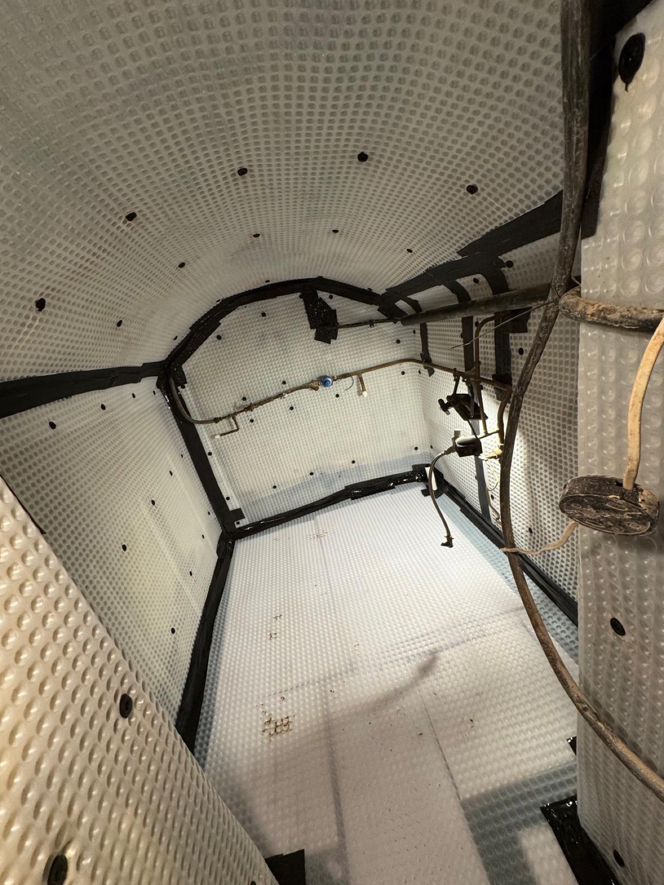 Waterproofing membrane fitted around an arched basement vault